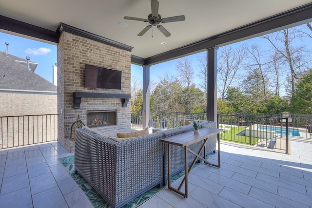 view of patio with an outdoor brick fireplace, ceiling fan, and a fenced in pool