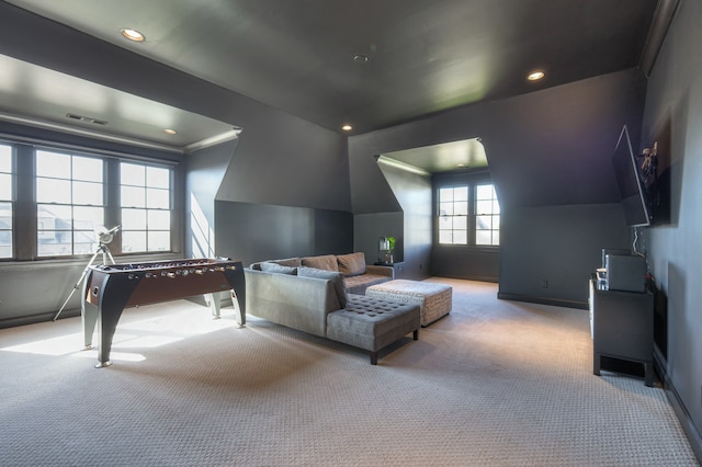 playroom with vaulted ceiling, a wealth of natural light, and carpet flooring