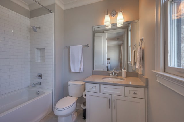 full bathroom with vanity, tiled shower / bath, ornamental molding, and toilet