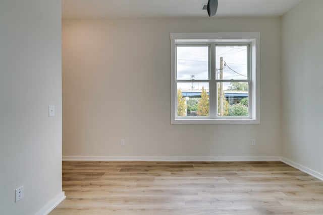 unfurnished room featuring light hardwood / wood-style flooring