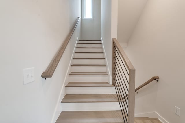 stairway featuring hardwood / wood-style flooring