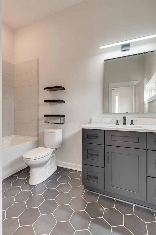 full bathroom featuring tile patterned flooring, vanity, toilet, and bathtub / shower combination