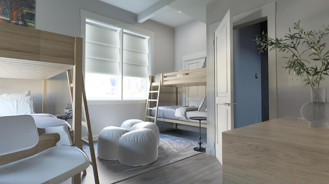 bedroom with hardwood / wood-style floors and beam ceiling