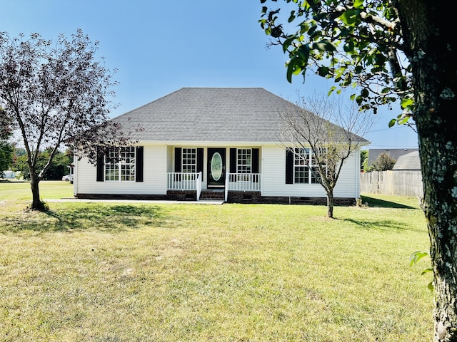 view of front of home with covered porch and a front lawn