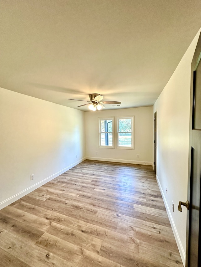 unfurnished room with ceiling fan and light hardwood / wood-style flooring