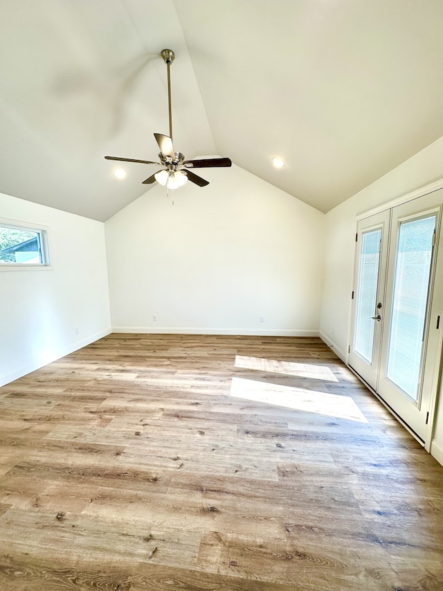 bonus room with ceiling fan, light wood-type flooring, french doors, and vaulted ceiling