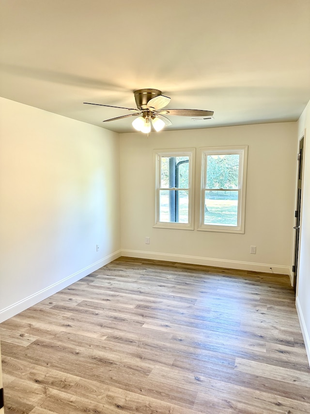 unfurnished room with light hardwood / wood-style floors and ceiling fan