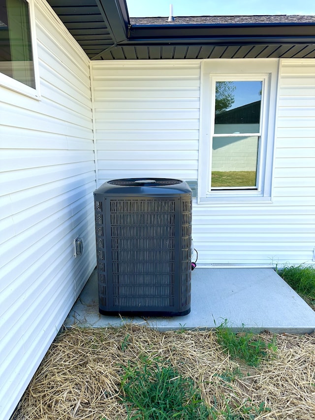 details with wood walls and central air condition unit