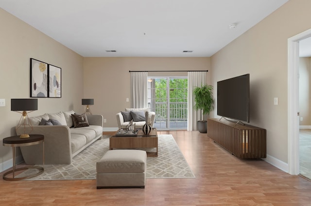 living room with light hardwood / wood-style floors