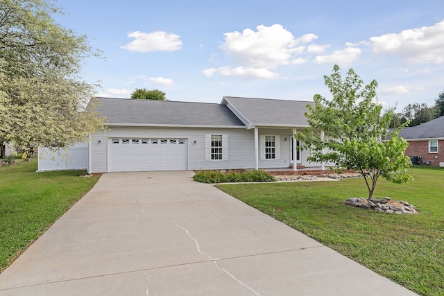 ranch-style home with a front yard and a garage