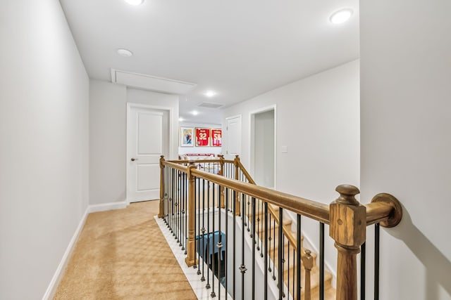 hallway featuring light carpet