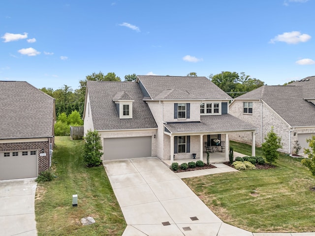 view of front of house with a front yard and a garage