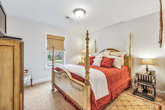 bedroom featuring light colored carpet