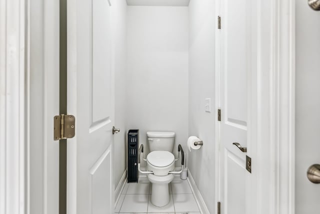 bathroom featuring toilet and tile patterned floors