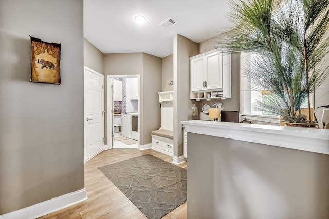 bathroom with hardwood / wood-style floors