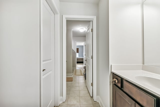 bathroom with tile patterned floors and vanity