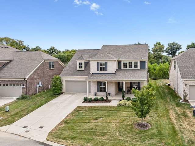 view of front of house with a porch and a front yard