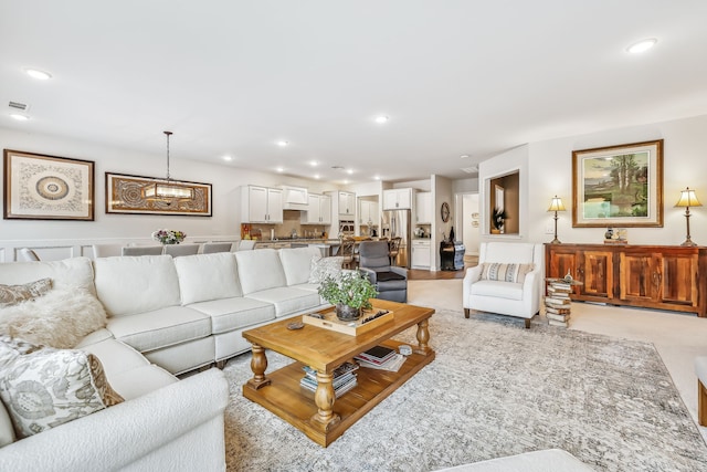 living room featuring a chandelier