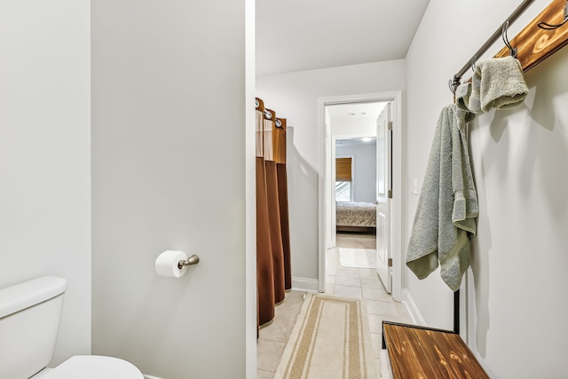 bathroom featuring tile patterned floors and toilet