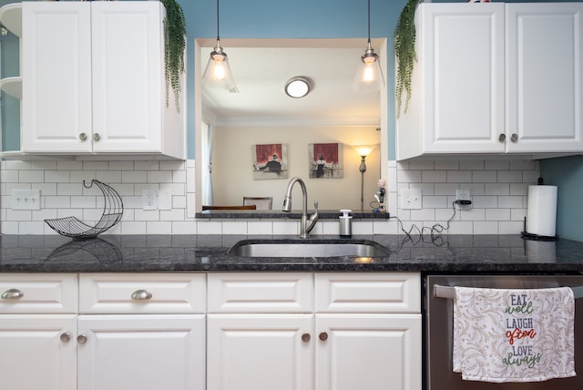 kitchen featuring dishwasher, white cabinetry, ornamental molding, and sink