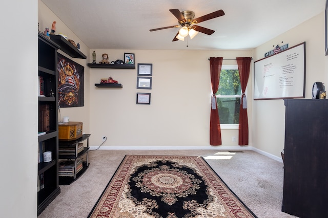 interior space featuring carpet and ceiling fan