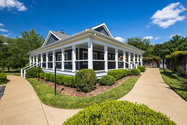 view of side of home with a porch