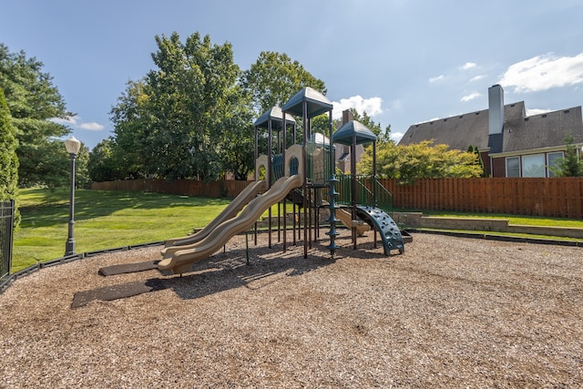 view of jungle gym with a lawn