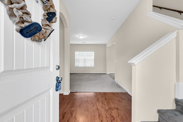 foyer entrance with light hardwood / wood-style floors