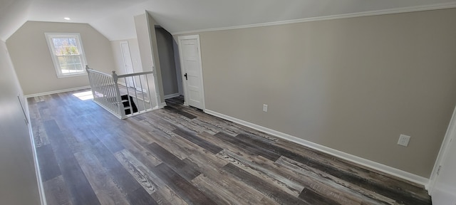 interior space featuring lofted ceiling and dark hardwood / wood-style floors