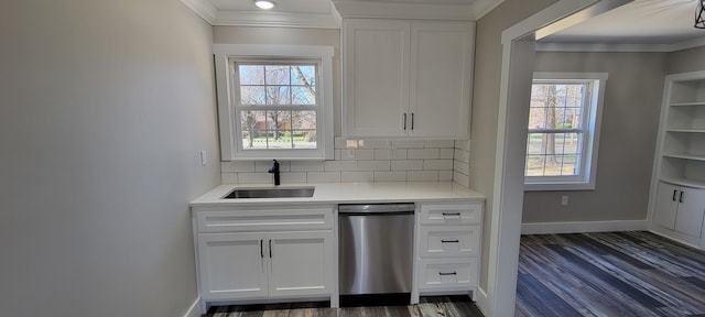 kitchen featuring a healthy amount of sunlight, dark hardwood / wood-style floors, sink, and stainless steel dishwasher