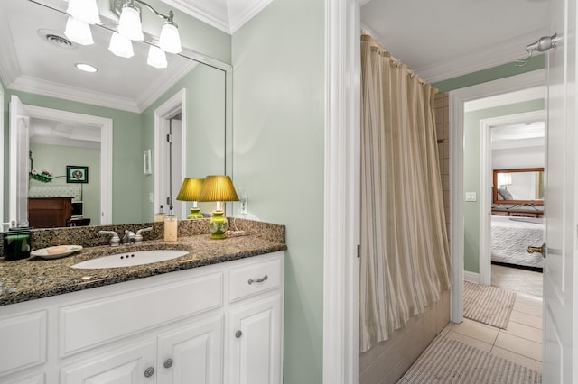 bathroom with crown molding, vanity, a shower with curtain, and tile patterned floors