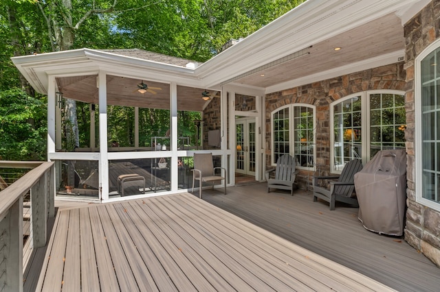 wooden terrace with ceiling fan and french doors