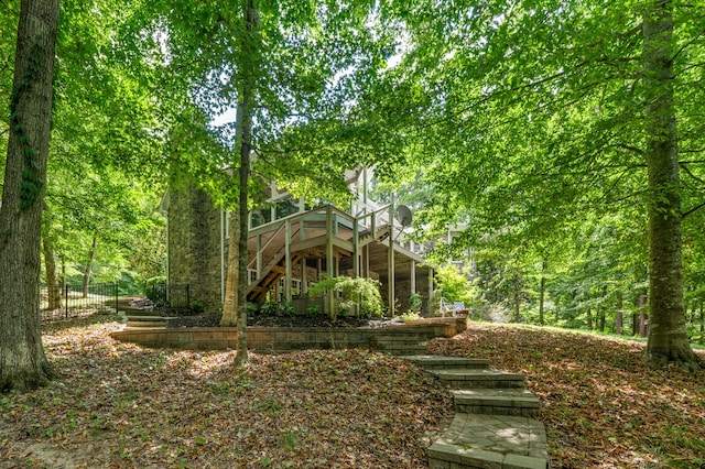 back of house featuring a wooden deck