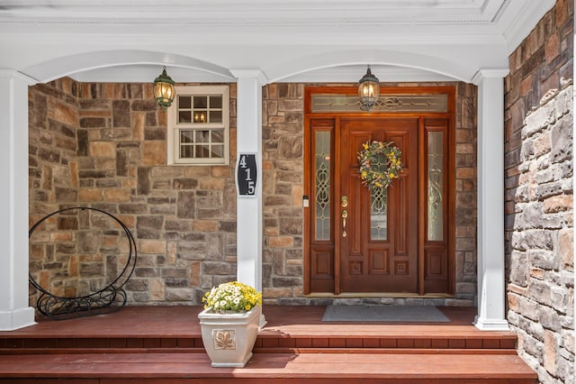 doorway to property with covered porch