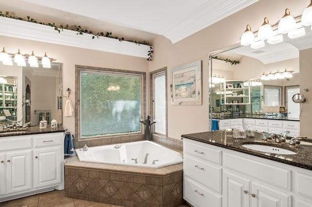 bathroom featuring ornamental molding, vanity, a relaxing tiled tub, and tile patterned flooring