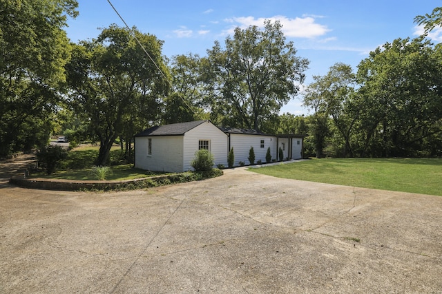 view of home's exterior with a yard