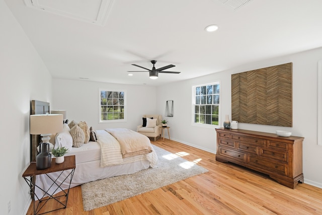 bedroom featuring light hardwood / wood-style floors and ceiling fan