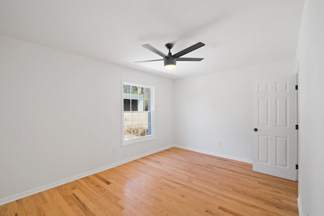 spare room featuring light hardwood / wood-style floors and ceiling fan