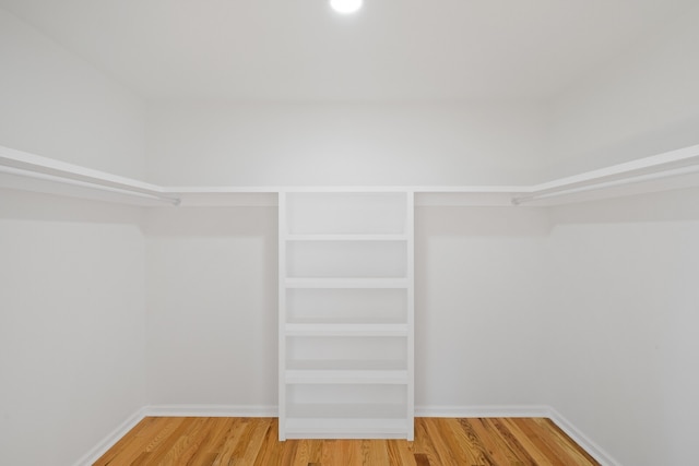 walk in closet featuring hardwood / wood-style flooring