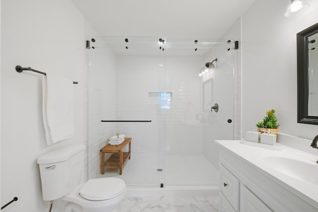 bathroom with toilet, vanity, and an enclosed shower