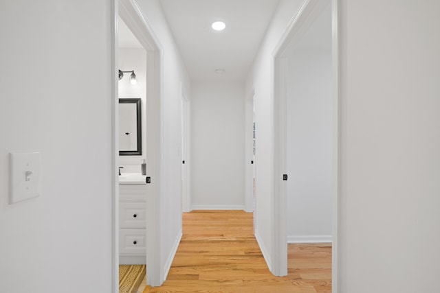 hallway featuring hardwood / wood-style flooring