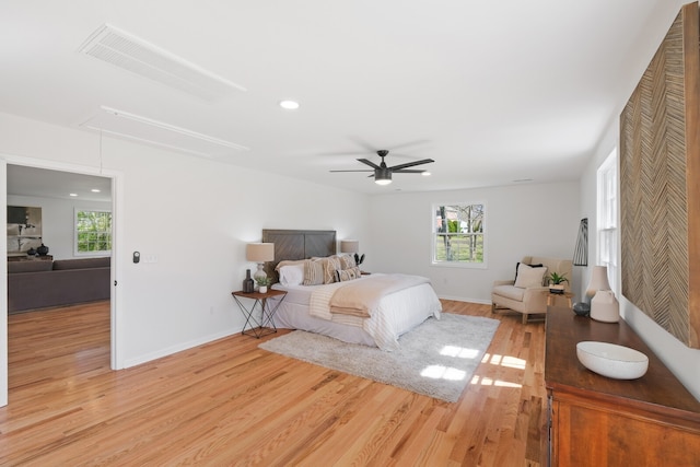 bedroom with light wood-type flooring and ceiling fan