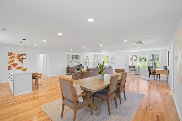 dining room with light hardwood / wood-style floors