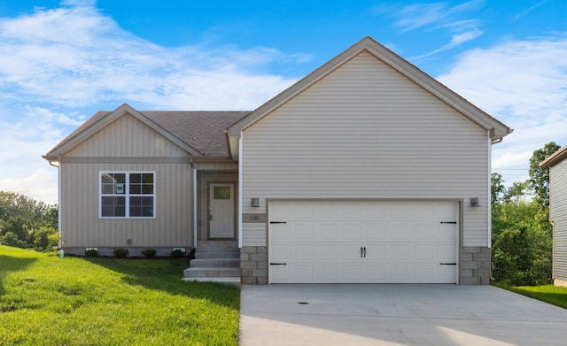 view of front of home featuring a garage and a front lawn