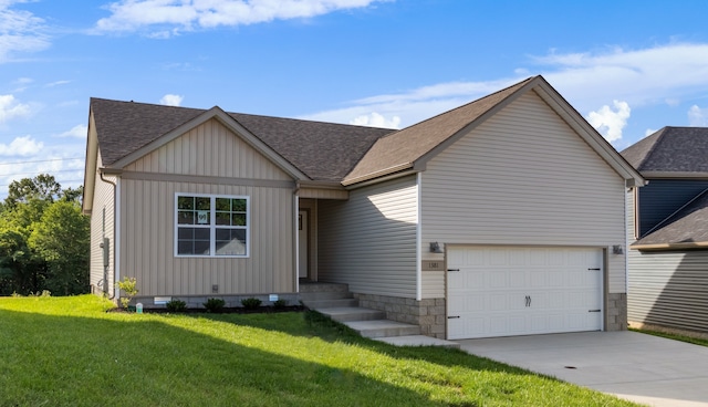 view of front of property with a garage and a front lawn