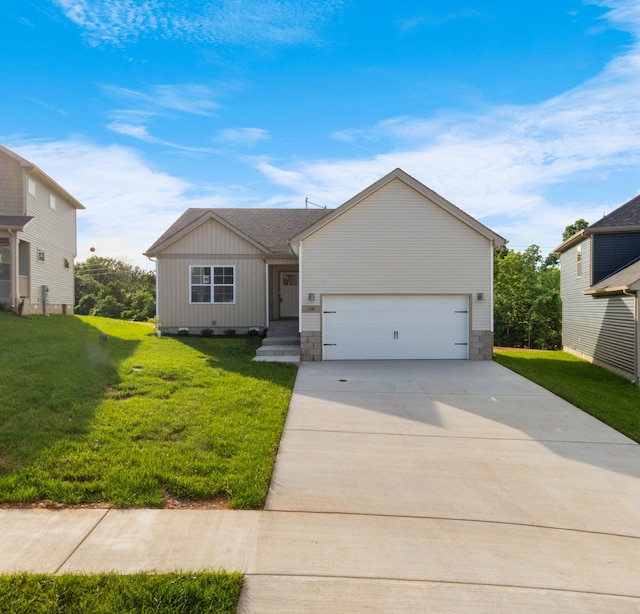 view of front facade with a front yard and a garage