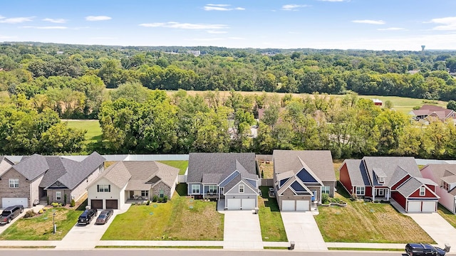 aerial view with a residential view and a view of trees