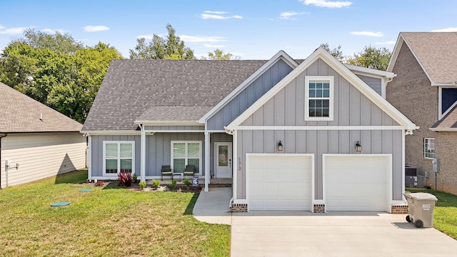 view of front of home with a garage and a front yard