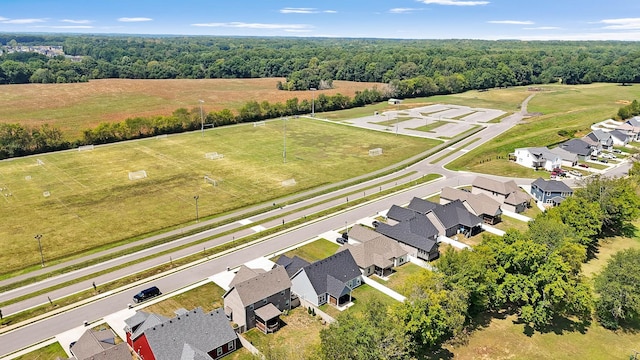 birds eye view of property with a residential view, a rural view, and a wooded view