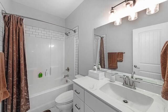 full bathroom featuring toilet, shower / bath combo with shower curtain, and vanity